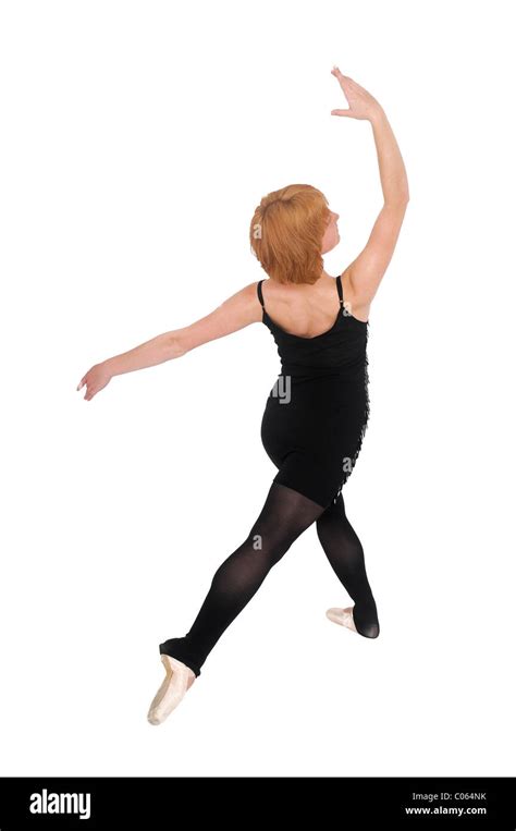 Female Ballet Dancer Balances On Her Toes On White Background Stock