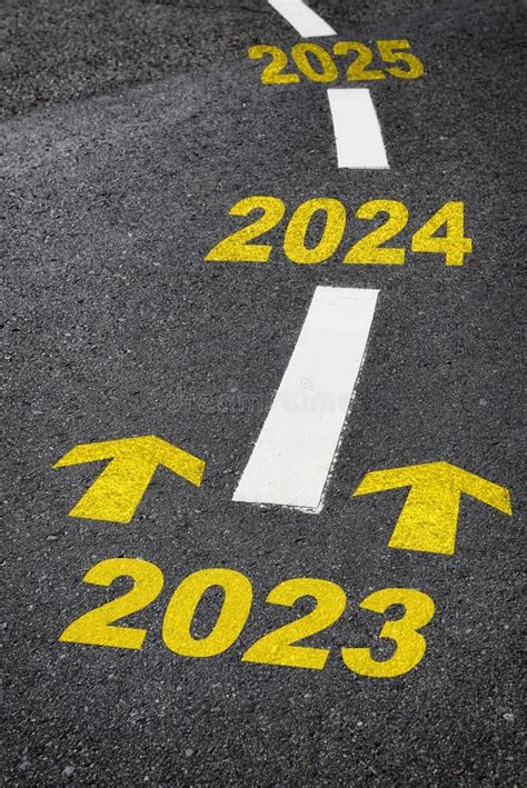 Road To Year 2023 2024 2025 With Yellow Arrow Marking On Road Stock