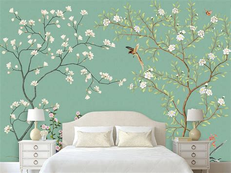The Bedroom Is Decorated With Flowers And Birds