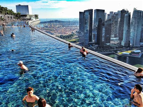 While the water in the infinity pool seems to end in a sheer drop, it actually don't look down: Swimming above skyline in Singapore PICs - Matador Network