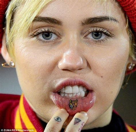 Miley Cyrus Immortalizes Pup Emu With Yet Another Tattoo Daily Mail