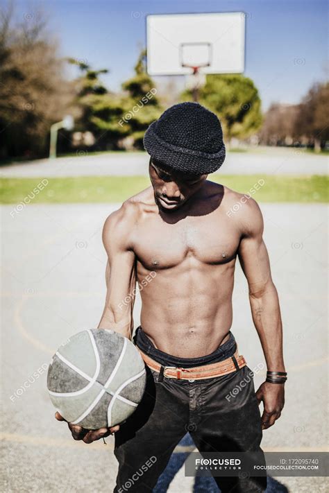 Portrait Of Young Man Holding Ball — Beanie Athlete Stock Photo