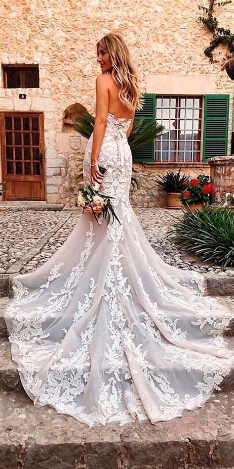 With so many different wedding styles and factors to consider like weather, color scheme and venue, finding the perfect dresses for wedding guest that also align with your personal style seems like a challenge. mermaid lace open back strapless neckline with train beach ...