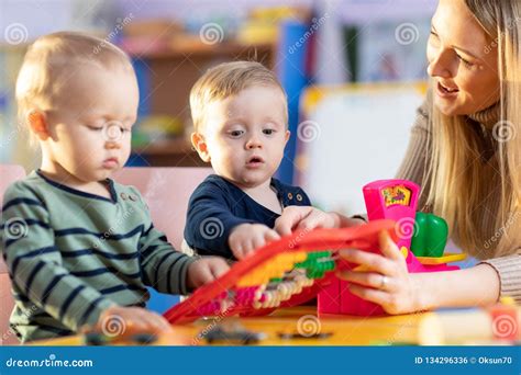 Two Kids Play Role Game In Toy Shop At Home Or Kindergarten Stock Photo