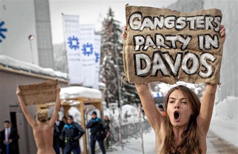 Topless Protesters Detained At Davos World Economic Forum New York