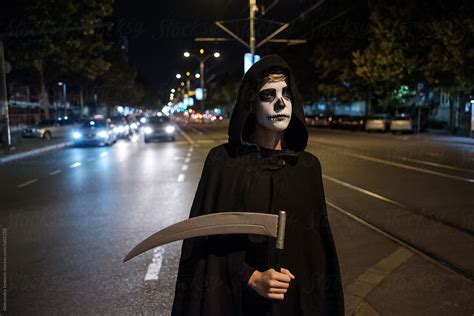 Portrait Of The Grim Reaper On The Street By Stocksy Contributor