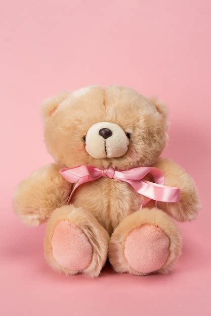Premium Photo Teddy Bear With Pink Ribbon