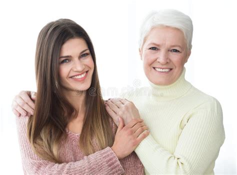 Happy Mother And Daughter Posing And Looking At Camera Stock Image