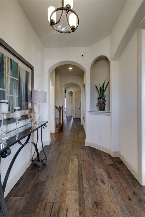 Who wouldn't want to live here? Gehan Homes Entryway - Long Hallway, Dark Rustic Hardwood ...