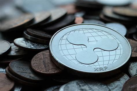 Cryptocurrency market & coin exchange report, prediction for the future: Ripple XRP coin on currency pile free image download