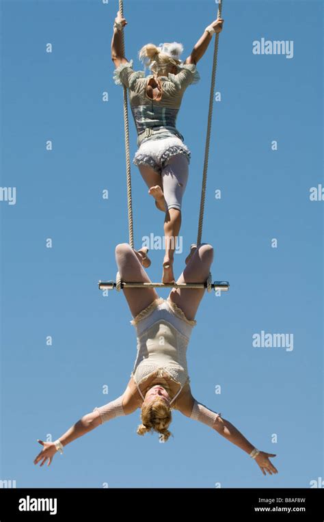 Two Female Trapeze Artists On Swing Stock Photo Alamy