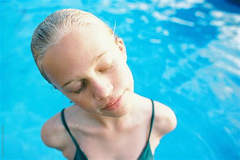 Blonde Teen With Short Wet Hair Portrait In Swimming Pool By Stocksy Contributor Wendy Laurel