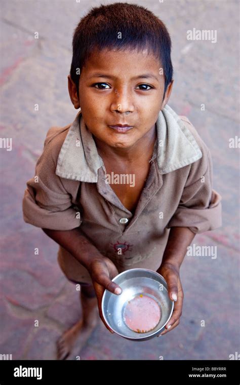 Young Boy Begging In The Streets Of Delhi India Stock Photo Alamy