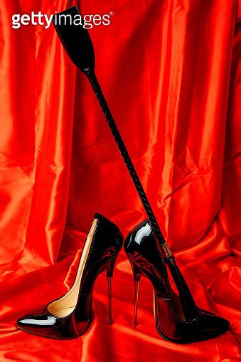 adult sex games bdsm items patent fetish extreme high heel stiletto heels and whip on a red