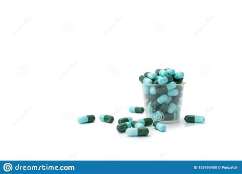 Capsule Pills Spread Out Of The Medicine Cup Stock Photo Image Of