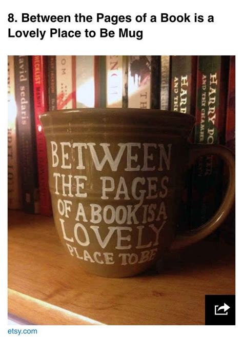 a coffee cup sitting on top of a wooden table next to bookshelves with the words between the