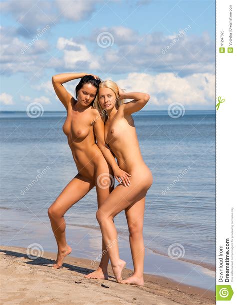 Two Nude Women Sunbathing On The Beach Stock Image Image