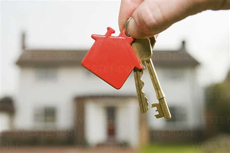 Person Holding House Keys Stock Photo
