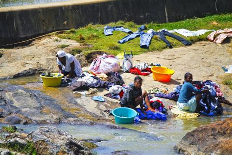 African Women Washing Clothes On A River Washed Clothes Are Lie Editorial Stock Image Image