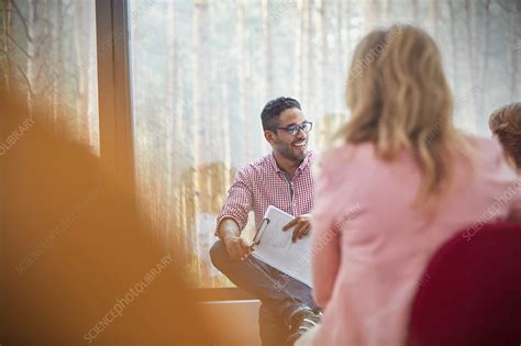 Smiling Man Talking In Group Therapy Session Stock Image F020 6603 Science Photo Library