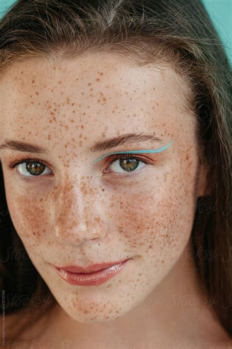 Face Of Young Freckled Woman With Green Eyes And Makeup By Liliya Rodnikova Stocksy United
