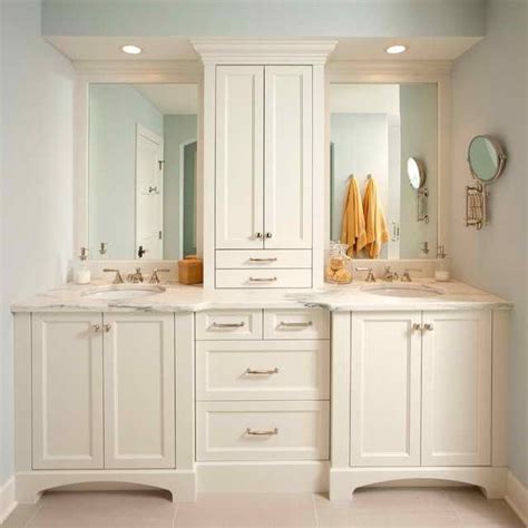 The linen tower can be installed free . Double Vanity With Center Cabinet | Bathroom freestanding ...