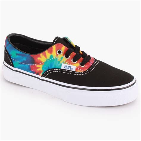 There are probably a couple of different methods to do so and this video shows you one of those tie a regular knot behind the tongue and tuck it deeper into the shoe so that when you are wearing them the knot doesnt bother you. Vans Tie Dye Era Kids Canvas Trainers Black Multicolour Kids