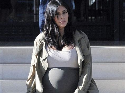 Pregnant Kim Kardashian Exposes Her Massive Bump In Body Hugging Outfit