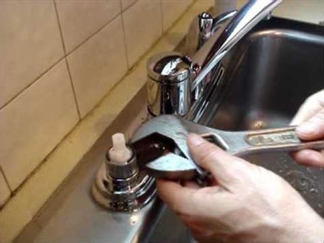 Chances are, your space is limited underneath that small bathroom sink, so any opportunity you have to remove something securing each component of the faucet (the handles and the faucet itself) will be a nut. Replace a Moen Kitchen Faucet Cartridge - YouTube