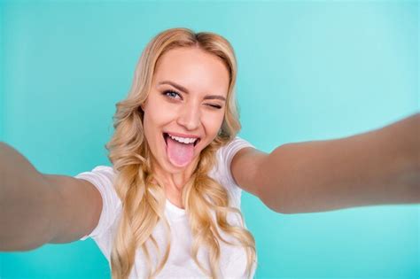 Premium Photo Cheerful Pretty Blonde Blogger Lady Make Selfie Show Tongue