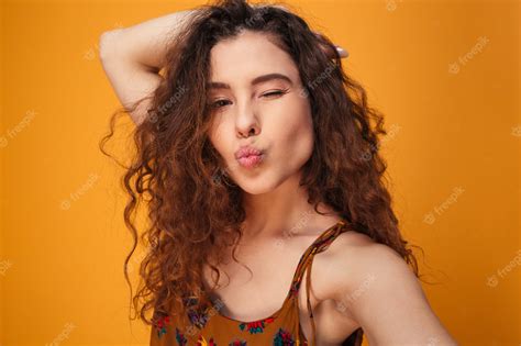 premium photo close up portrait of a flirty curly haired girl