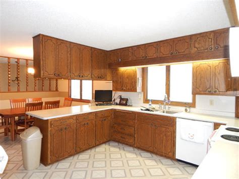 Old world styles (think rustic tuscany or spanish colonial) are more forgiving of everyday kitchen. Need ideas for 1970's oak kitchen cabinet update