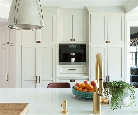 Reasons why kitchen cabinets should not go to the ceiling. Floor to ceiling cream shaker cabinets in a transitional ...