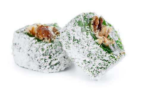 Premium Photo Green Turkish Delight With Nuts On Powdered Sugar