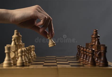 Hand Moving White Pawn And Making First Step Stock Photo Image Of