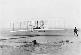 Image result for powered airplane flight took place near Kitty Hawk, NC. Orville and Wilbur Wright made the flight.