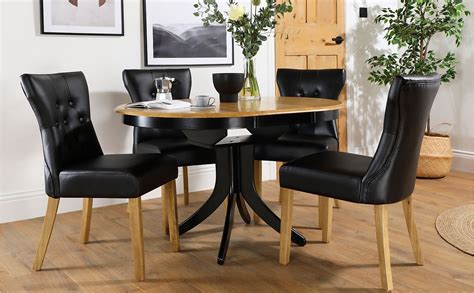 Hudson Round Painted Black And Oak Extending Dining Table With 4 Bewley