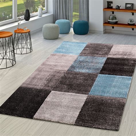 Featuring a clean border that adds to its visual, this hand tufted wool rug is a perfect addition to any modern home décor. Teppich Modern Kariert Blau Anthrazit | teppichmax