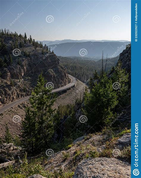 Curve Of Road Around Cliff In Yellowstone National Park Stock Image
