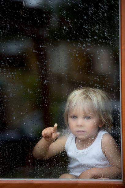 Sad Boy Rainy Stock Photos Pictures And Royalty Free Images Istock