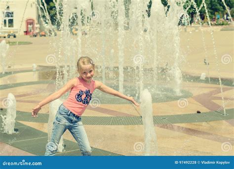 Little Girl Playing With Water In City Fountain Stock Photo Image Of