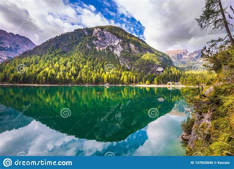 The Turquoise Water Reflects Mountains Stock Photo Image Of Scenic