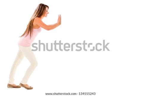 Casual Woman Pushing Something Imaginary Isolated Stock Photo