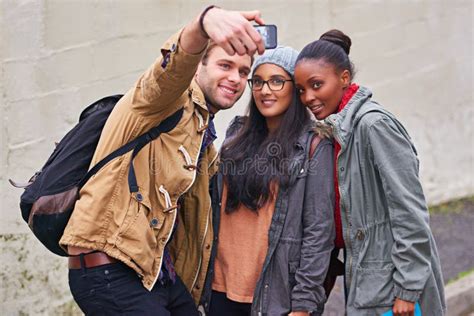 Student Life Snapshots A Group Of College Students Taking A Selfie On