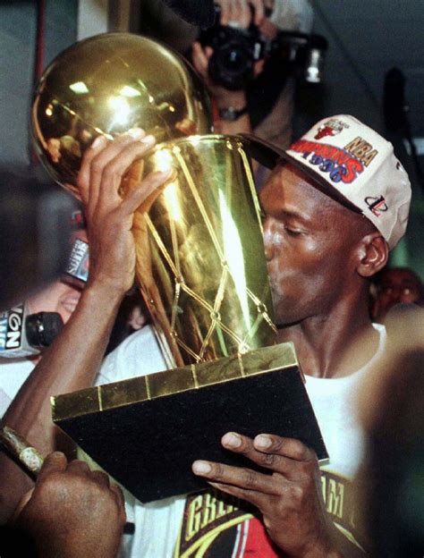 Michael Jordan Having An Intimate Moment With The Nba Championship Trophy In The Chicago Bulls