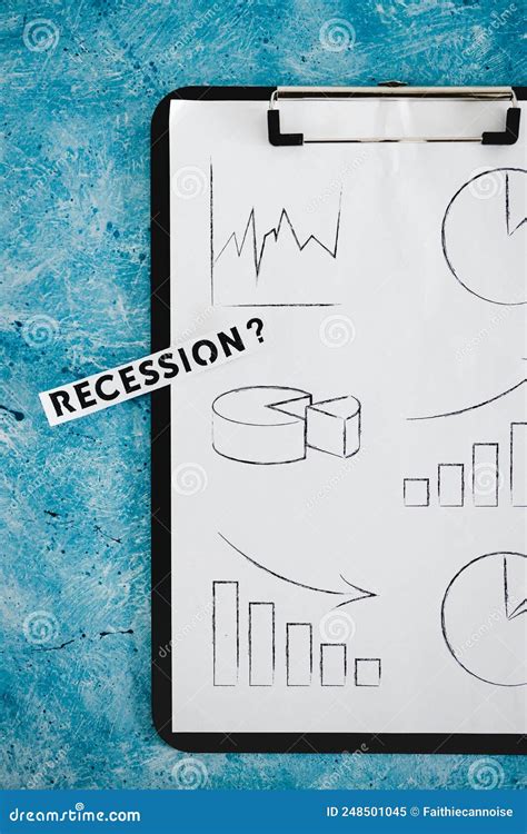 Recession Text Next To Clipboard Showing A Multitude Of Stas And Graphs