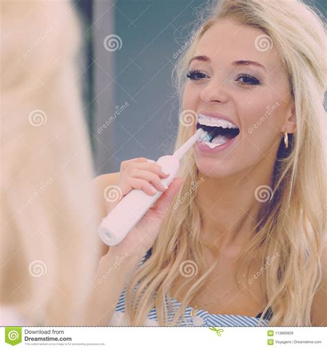 Woman Using Electric Toothbrush Stock Image Image Of Electric