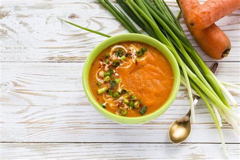 Carrot Puree Soup With Sour Cream And Green Onion Stock Photo Image