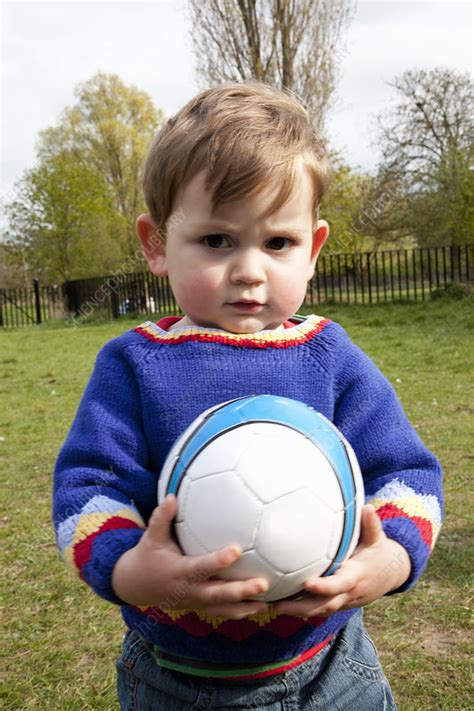 Boy Holding Soccer Ball In Backyard Stock Image F0058114 Science