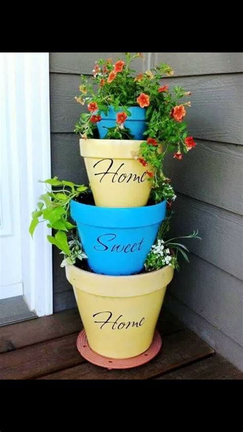 Pin By Susie Gauldin On Outdoor Decor Stacked Flower Pots Garden